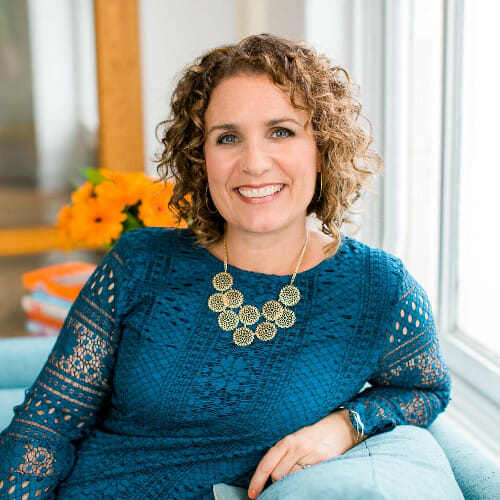 LinkedIn, profile photo, woman with curly hair in blue sweater